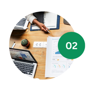 Group of hands discussing data on table with 02 laid on top