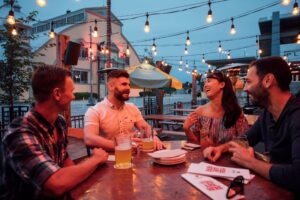 Friends enjoying an Ottawa evening on a patio together. 